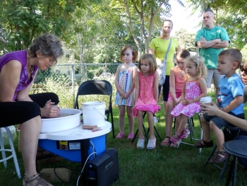 pottery on sale by Debra Griffin and demos by student Tonya at Ashland Farmers Market, Ashland MA