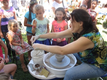 pottery on sale by Debra Griffin and demos by student Tonya at Ashland Farmers Market, Ashland MA